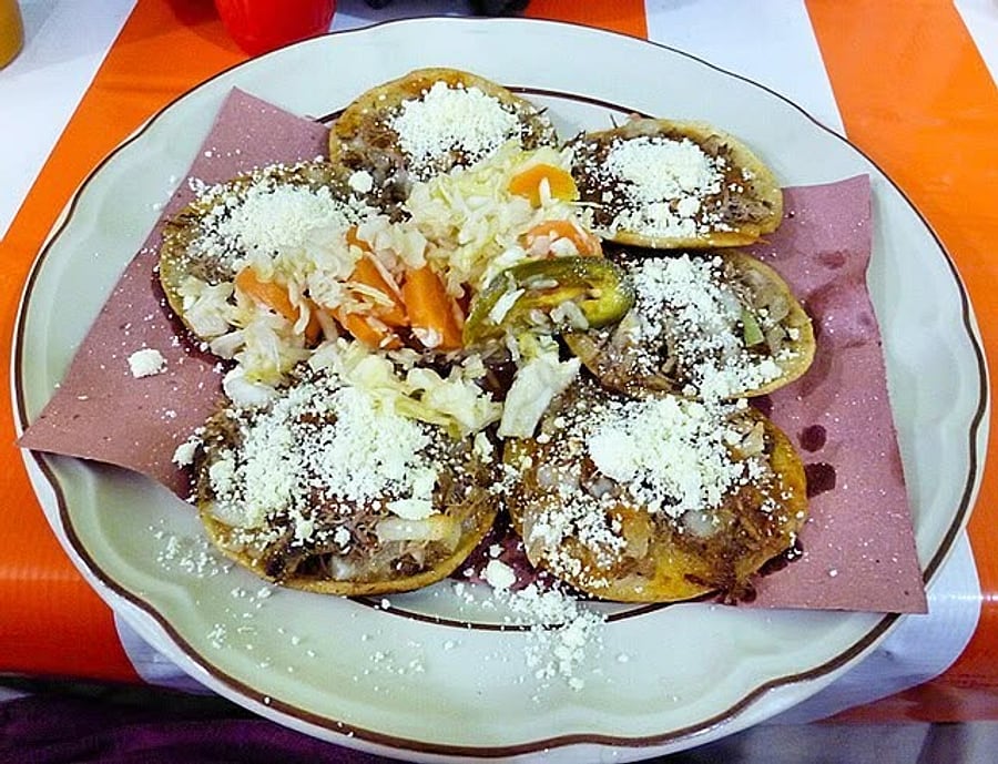 Sopes with cheese and onion at El Pollo Tote
